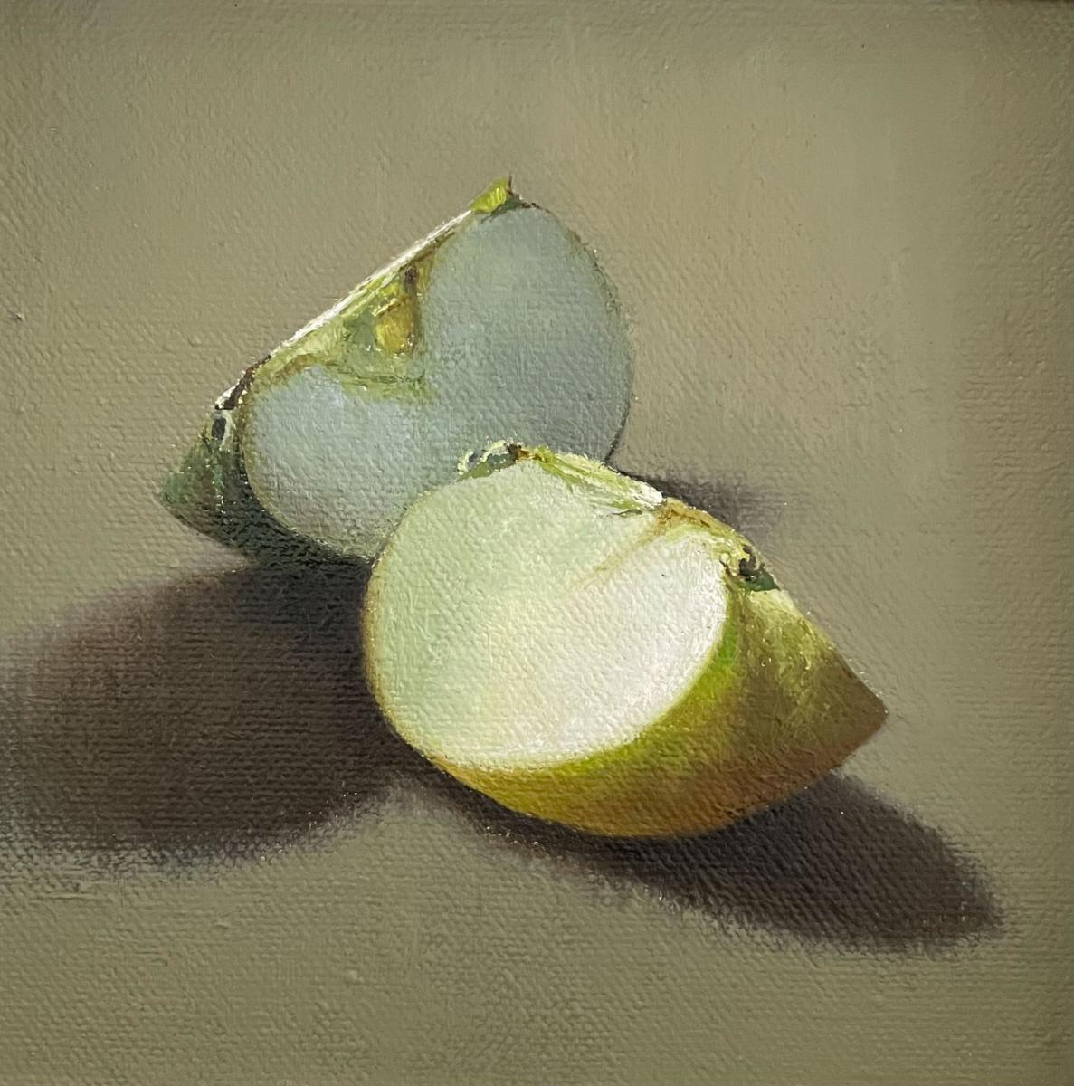 a small painting of two quarters of an apple