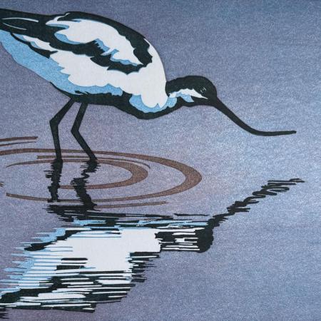 a print of an avocet standing in water