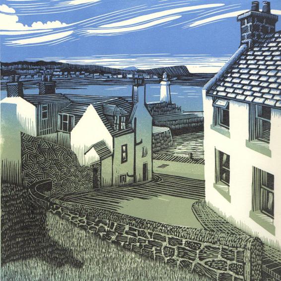 a view of the sea between houses
