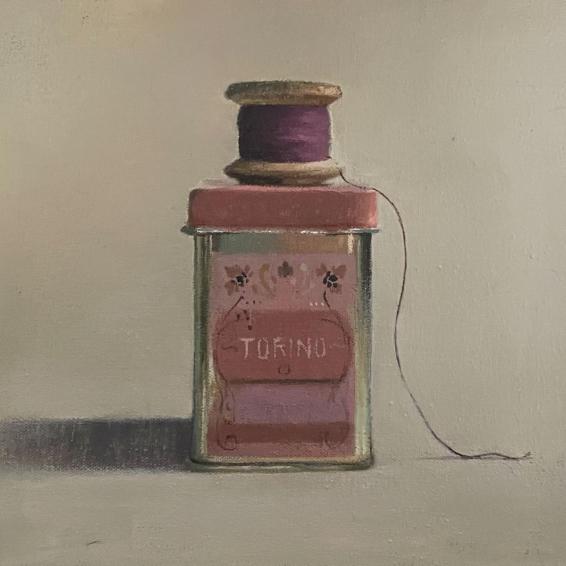 a small painting of a tin with a spool of thread