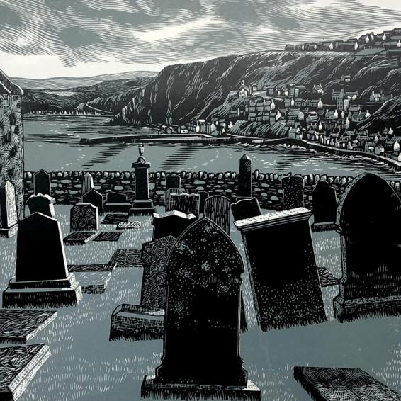 a lino print of a graveyard with hills in the distance