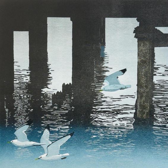 a linocut of seagulls under a pier