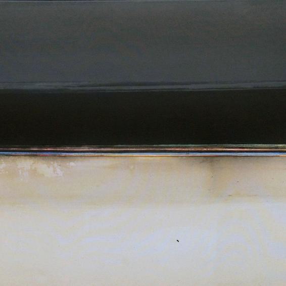 a semi abstract painting of dark sky and water